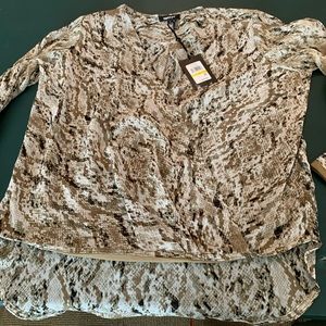 Dkny blouse. Multi color. Size M. New with tags. 100%polyester.